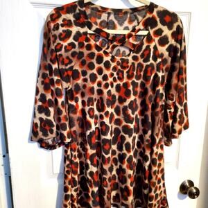 Woman's animal print top Bell sleeves Criss cross neckline